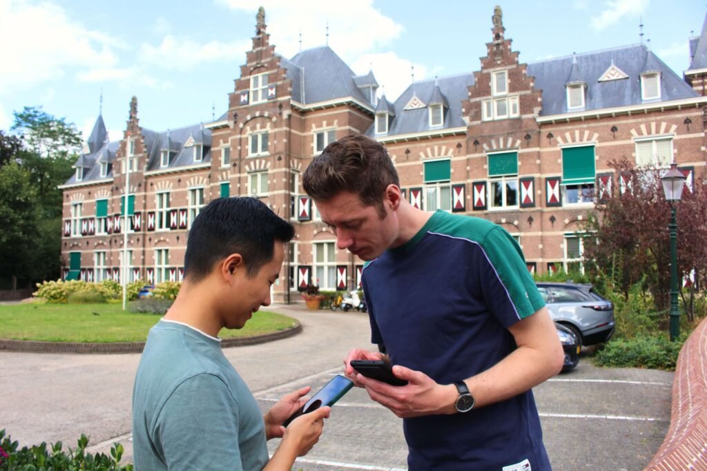 Players checking the Qugato game on their phones
