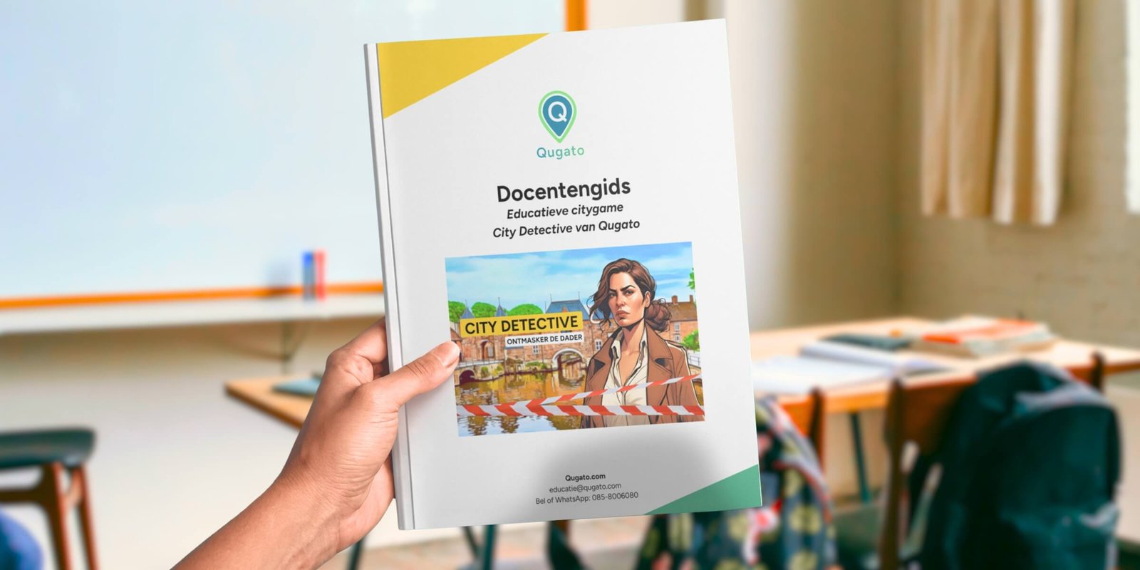 Teacher in a classroom holding up the Qugato Teacher’s Guide for an educational school trip.