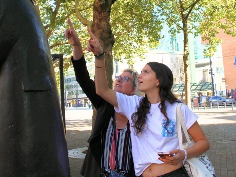 pair-pointing-at-sign