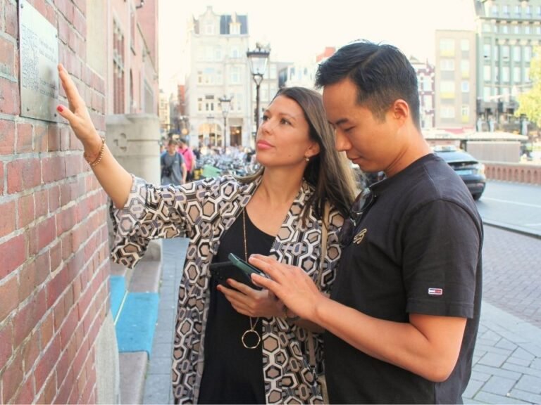 players-examining-wall-detail